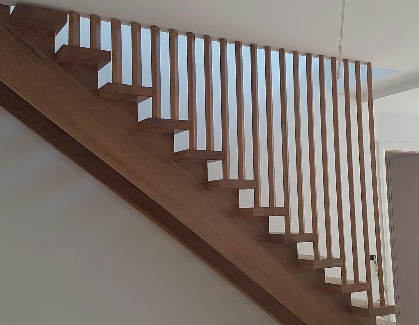 The minimalist stair screen makes a bold statement with stunning results. Modern, elegant and creative.